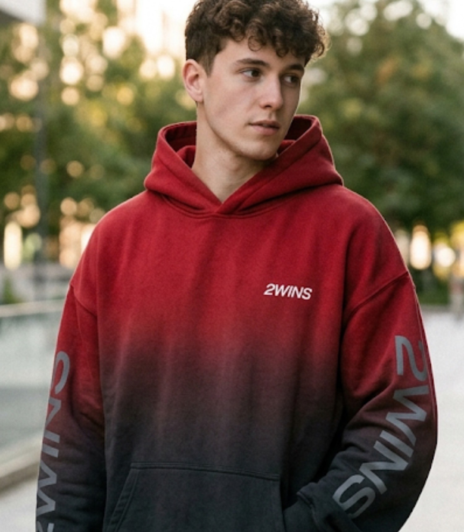 Model wearing the 2WINS Fade Hoodie in Crimson